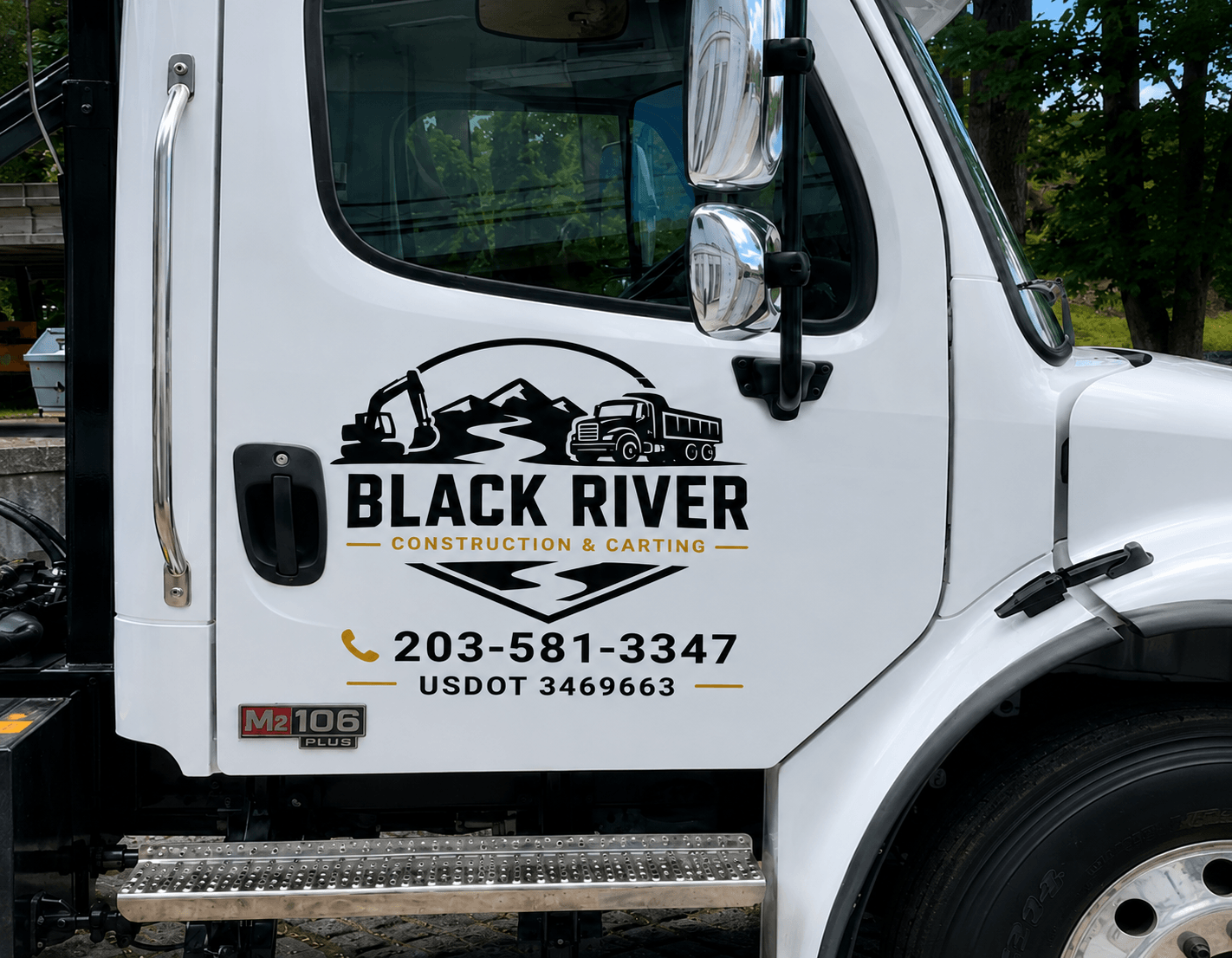 Black River Construction owner beside white dump truck at Connecticut job site